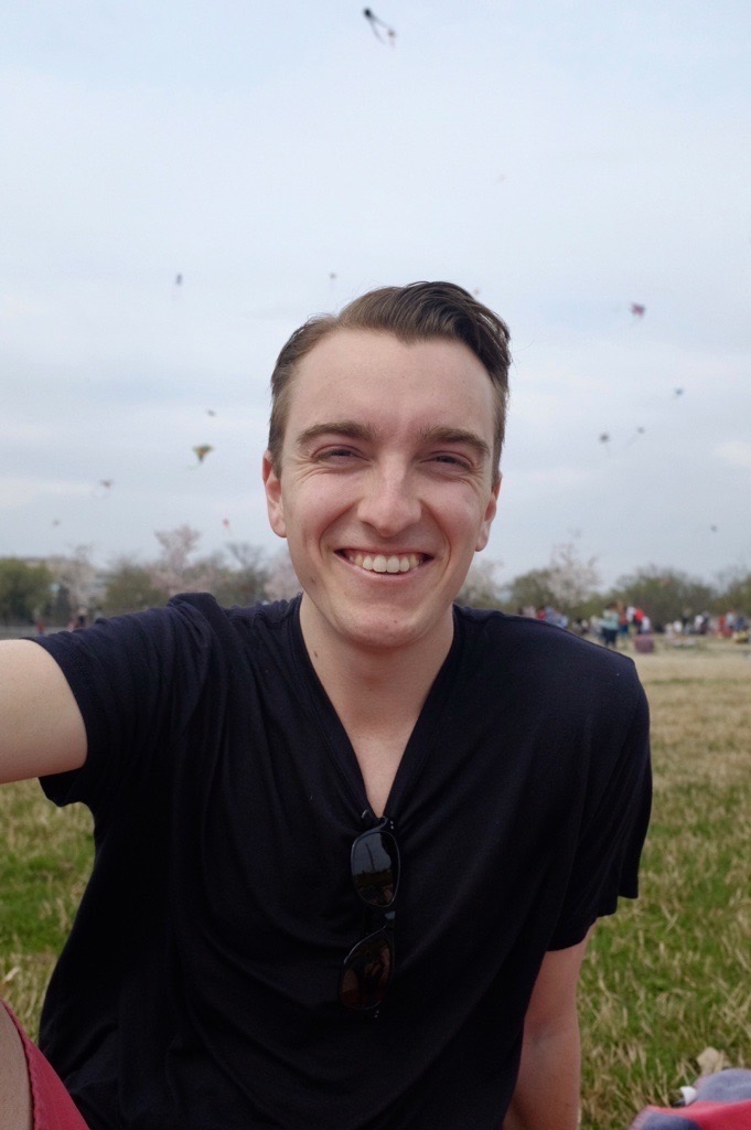 Emmet smiling in a large field