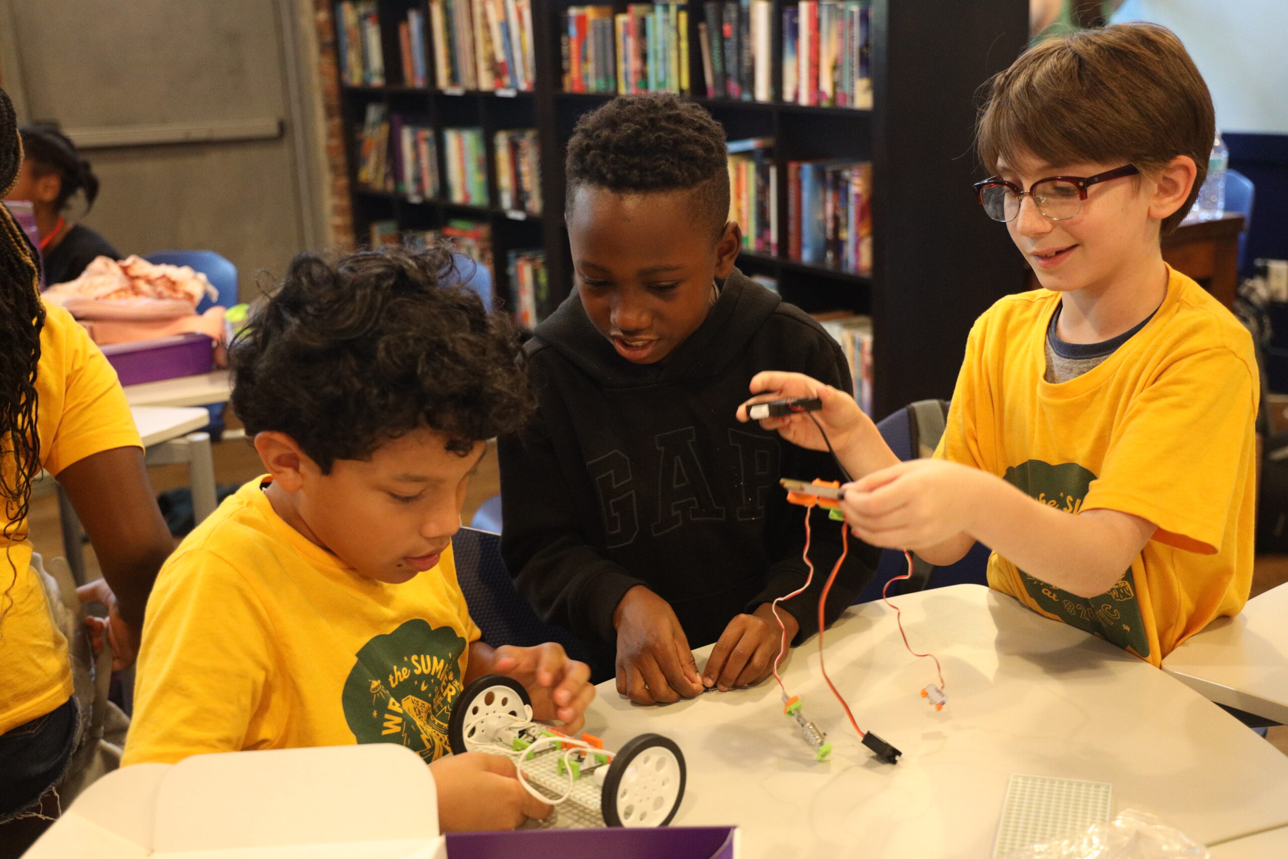 Students collaborate on a circuitry project using Little Bits during the summer Sci-Fi & Circuitry workshop.